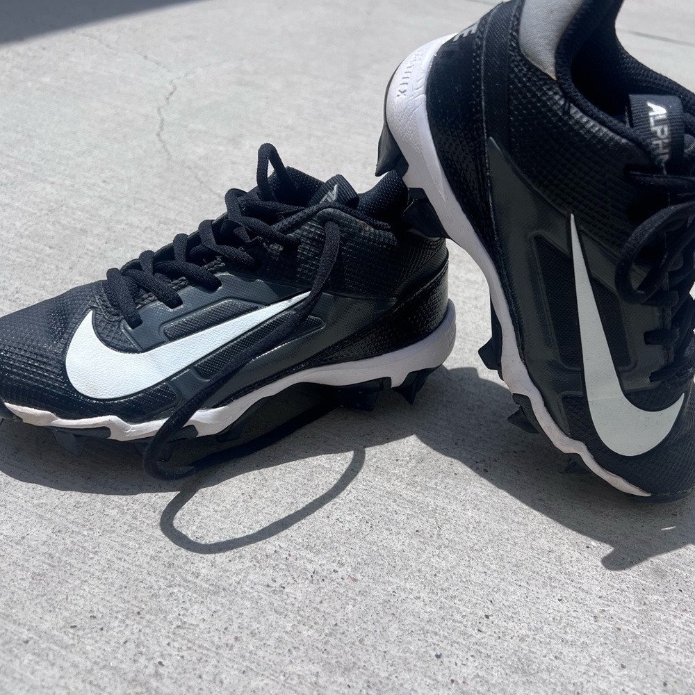 Nike kids Black and White cleats